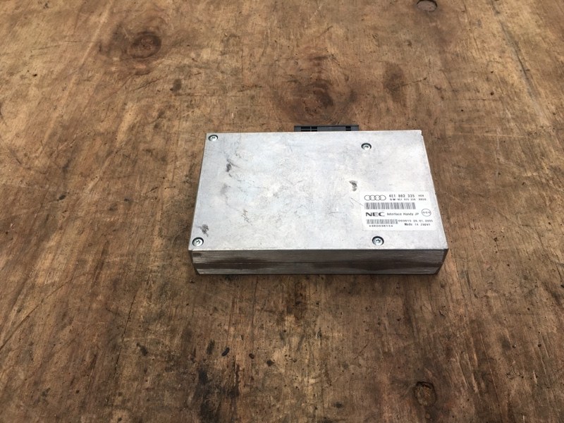 Блок управления телефоном MMI NEC на Audi A6 C6 4F / Ауди А6 С6 2006-2012г.\nОригинал.\nРабочий, проверен.\nКонтрактная запчасть из Японии. Гарантия на все запчасти. Отправим в регионы ТК.