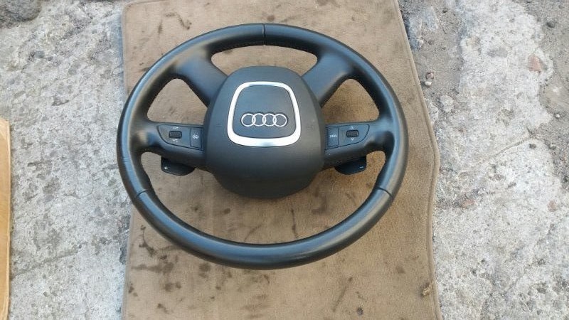 Рулевое колесо руль / мультируль с кнопками на Audi Allroad A6 C6 / Ауди Олрод Алроад А6 С6 2006-2012г.\nОригинал.\nС подрулевыми переключателями / лепестками.\nВ отличном состоянии. Кожа целая. Не затертая. \nКонтрактная запчасть из Японии. Без пробега п